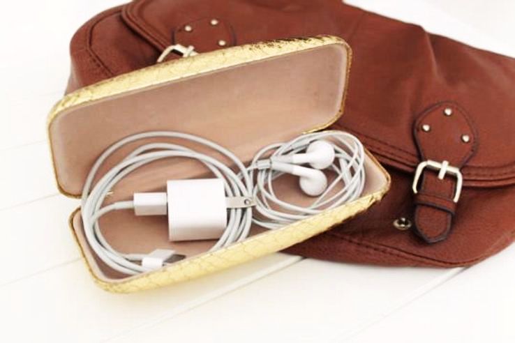 Store your loose cables and chargers in an old sunglasses case.